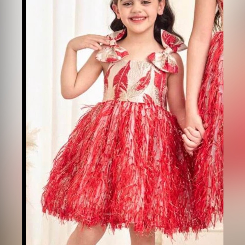 SHEIN girls' special occasion dress a red and gold feather skirt.